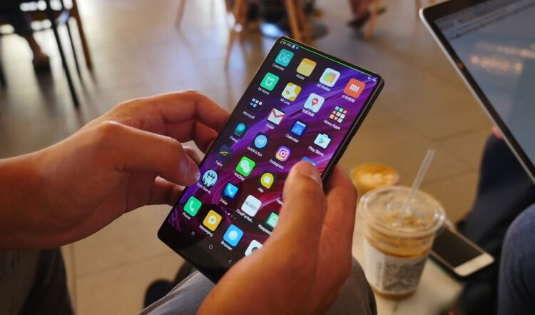 Person using smartphone in cafe